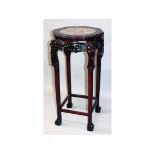 A CHINESE HARDWOOD AND MARBLE INSET STAND. 1ft 6ins diameter x 3ft 0ins high.