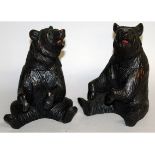 A PAIR OF "BLACKFOREST" CARVED WOOD SEATED BEAR TERRACOTTA JARS. 8ins high.