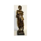 AFTER THE ANTIQUE A STANDING BRONZE OF A ROMAN on a square marble base.