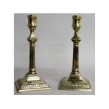 A PAIR OF GEORGE III PAKTONG CANDLESTICKS on square stepped bases. 9.5ins high.