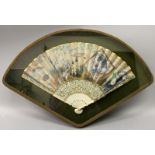 A FINE QUALITY 18TH/19TH CENTURY CHINESE PAINTED PAPER FAN, mounted in a glass fronted display case,