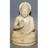 A SOUTH-EAST ASIAN CARVED IVORY FIGURE OF BUDDHA, seated in meditation on a shallow double lotus