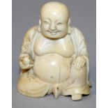 A SMALL 19TH CENTURY CHINESE CARVED IVORY FIGURE OF BUDAI, seated with cheerful expression, 1.75in