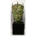 A GOOD LARGE THAI BRONZE HEAD OF AMITAYUS BUDDHA, mounted on a rectangular wood plinth, the whole