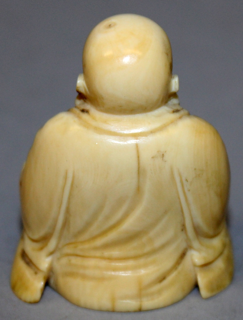 A SMALL 19TH CENTURY CHINESE CARVED IVORY FIGURE OF BUDAI, seated with cheerful expression, 1.75in - Image 3 of 6