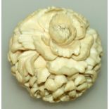 A GOOD QUALITY EARLY 20TH CENTURY SIGNED JAPANESE IVORY BALL, carved overall in high relief with a