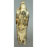 A GOOD 19TH/20TH CENTURY CHINESE CARVED IVORY FIGURE OF GUANDI, holding a long spear, his