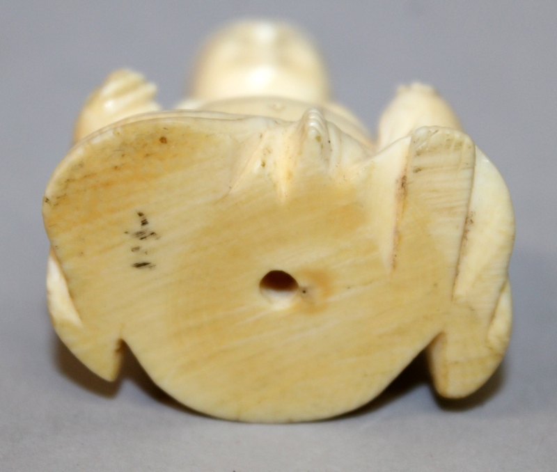 A SMALL 19TH CENTURY CHINESE CARVED IVORY FIGURE OF BUDAI, seated with cheerful expression, 1.75in - Image 6 of 6