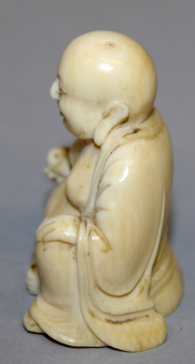 A SMALL 19TH CENTURY CHINESE CARVED IVORY FIGURE OF BUDAI, seated with cheerful expression, 1.75in - Image 4 of 6