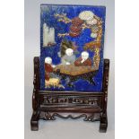 A CHINESE ONLAID LAPIS TABLE SCREEN, with wood stand, 4.23in wide at widest point & 6.7in high.