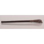 A TRIBAL OR NEAR EASTERN WOOD STICK, the handle carved with repeated circular motifs, 17.25in long.