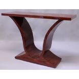 AN ART DECO STYLE ROSEWOOD CONSOLE TABLE, the rectangular top supported on curving sides with