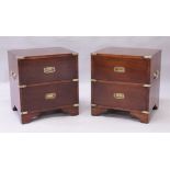 A PAIR OF MILITARY STYLE MAHOGANY TWO DRAWER CHESTS, each with brass bound corners, carrying