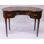 AN EDWARDIAN MAHOGANY KIDNEY SHAPE DESK, with leather inset top, central frieze drawer flanked by