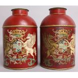 A PAIR OF RED TOLEWARE TINS AND COVERS, decorated with a Coat of Arms. 14.5ins high.