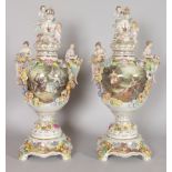 A GOOD PAIR OF DRESDEN STYLE FLOWER ENCRUSTED VASES, COVERS AND STANDS, the lids with crest and