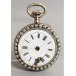 A LADIES SILVER POCKET WATCH with reverse pug dog.