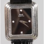 A LADIES PIAGET BLACK FACE WRISTWATCH and strap, No. 74101-288684.