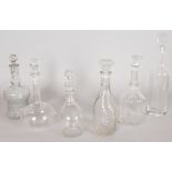 SIX VARIOUS DECANTERS AND STOPPERS.