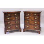 A PAIR OF GEORGE III DESIGN BACHELOR CHESTS, each with a fold-over top, four graduated long