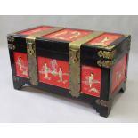 A CHINESE LACQUER CHEST with brass mounts and mounted with ivory figures. 3ft 4ins long.