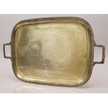 A PLAIN TWO HANDLED RECTANGULAR TEA TRAY with gadrooned border. 21ins long, 13ins wide. London 1928.