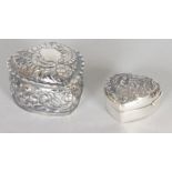 TWO EMBOSSED SILVER HEART SHAPED PILL BOXES.