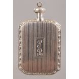 AN ENGRAVED SILVER SCENT BOTTLE.