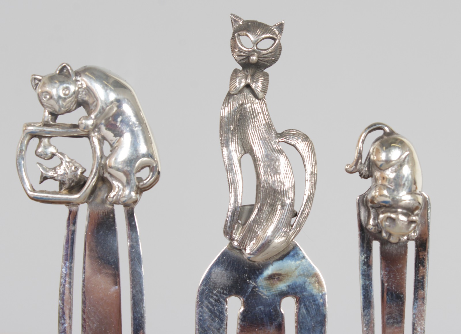 THREE SILVER NOVELTY CAT BOOK MARKERS.