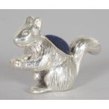 A NOVELTY SILVER SQUIRREL PIN CUSHION.