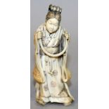 AN UNUSUAL GOOD QUALITY JAPANESE MEIJI PERIOD IVORY OKIMONO OF A LADY, standing in floral and