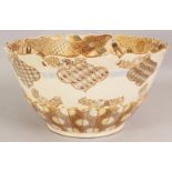 A LARGE EARLY 20TH CENTURY JAPANESE SATSUMA EARTHENWARE BOWL, the interior painted with panels of