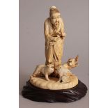 A JAPANESE MEIJI PERIOD IVORY OKIMONO OF A STANDING MAN & THREE MONKEYS, together with a carved wood