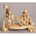 A GOOD SIGNED JAPANESE MEIJI PERIOD IVORY OKIMONO OF A MAN PULLING A CART, upon which his son is