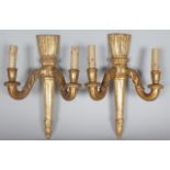 A PAIR OF 19TH CENTURY FRENCH CARVED AND GILDED TWO LIGHT WALL SCONCES with quiver backs. 16ins