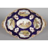 A 19TH CENTURY FLIGHT BARR AND BARR WORCESTER LARGE DISH painted with gilt cartouches of birds,