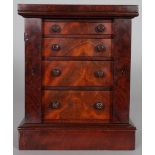 A 19TH CENTURY MAHOGANY MINIATURE WELLINGTON CHEST, with four long drawers on a plinth base. 8.