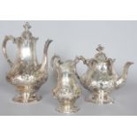 A VICTORIAN THREE PIECE TEA SET by THE BARNARDS, comprising teapot, coffee pot and milk jug.