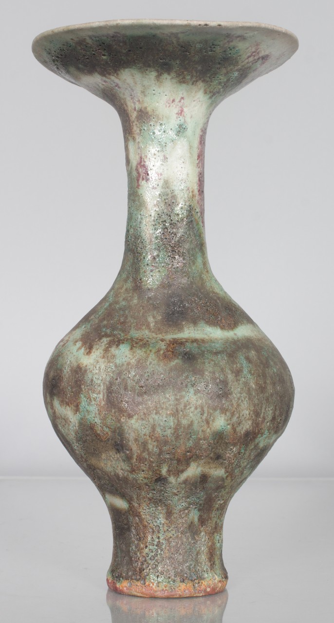 DAME LUCIE RIE (1902-1995) AUSTRIAN A SPECKLED POTTERY VASE with flared lip and volcanic glaze.