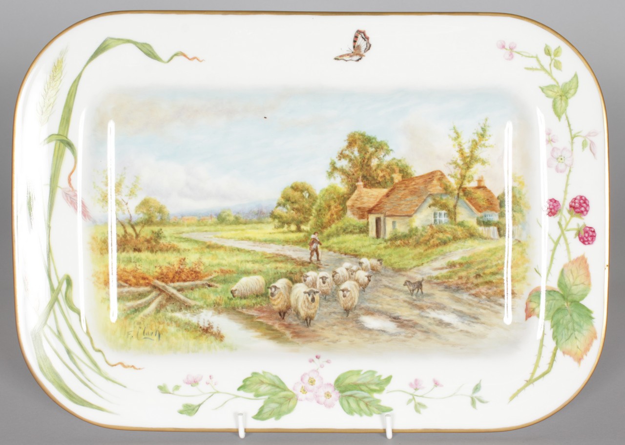 A ROYAL WORCESTER FINE PLATTER painted with a farmyard scene with dog and sheep by Francis Clark,