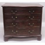 A GOOD GEORGE III MAHOGANY SERPENTINE COMMODE with brushing slide over four graduated long