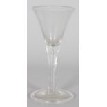 A GEORGIAN TAPERING PLAIN WINE GLASS with teardrop. 6.5ins high.