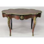 A 19TH CENTURY DESIGN "BOULLE" WRITING TABLE of serpentine outline, with leather inset writing