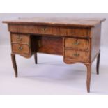 A LOUIS XV KINGWOOD PARQUETRY KNEEHOLE DESK, the rectangular bi-fold top opening to reveal three