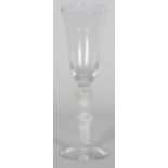 A GEORGIAN WINE GLASS with long tapering bowl, air twist stem with two knops. 7.5ins high.