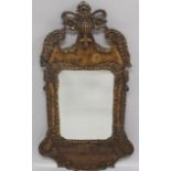 AN 18TH CENTURY STYLE FRETWORK MIRROR, EARLY 20TH CENTURY, with carved, painted and gilded