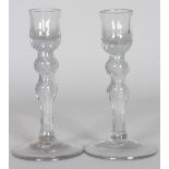 A PAIR OF 18TH CENTURY "POSSIBLY NEWCASTLE" AIR TWIST CANDLESTICKS, two knops to the stem. 6ins