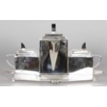 AN ART DECO STYLE THREE PIECE TEA SET, on a fitted tray. 1ft 4ins long.