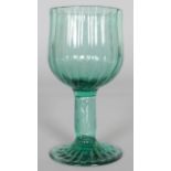 A GREEN HOLLOW STEM RIBBED WINE GLASS, CIRCA 1740. 4.75ins high.