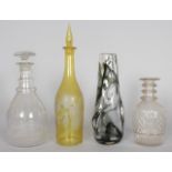 THREE VARIOUS DECANTERS AND A VASE.